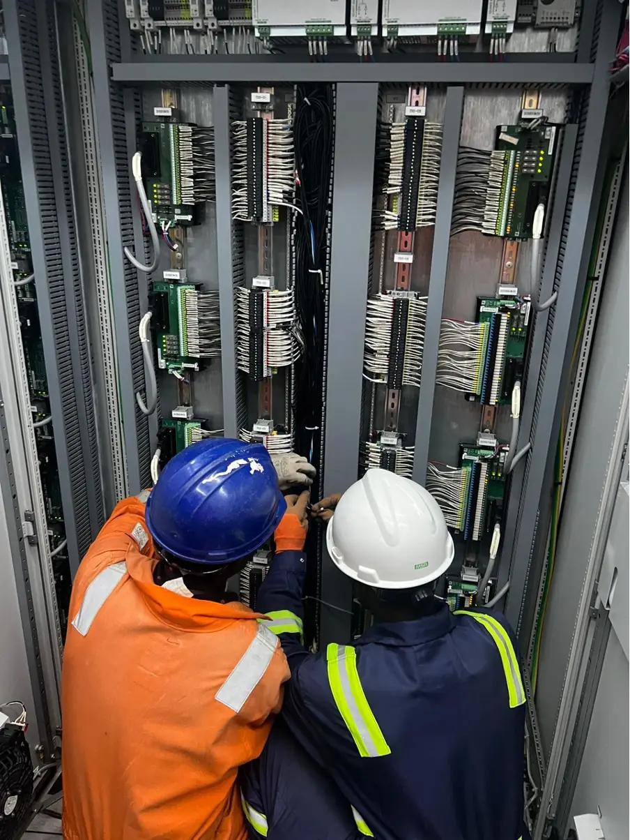 ICSIGH engineers working on a marshalling cabinet